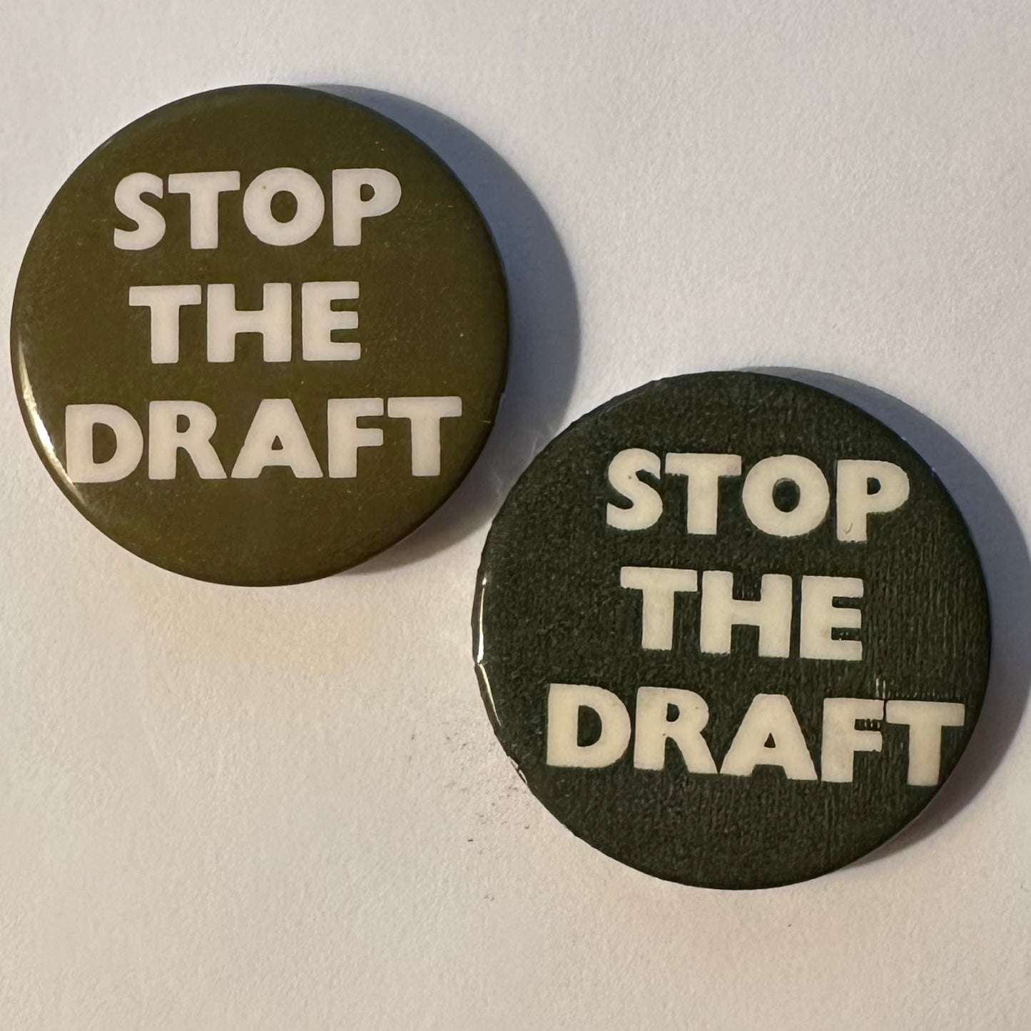 Pair of Stop the Draft Buttons