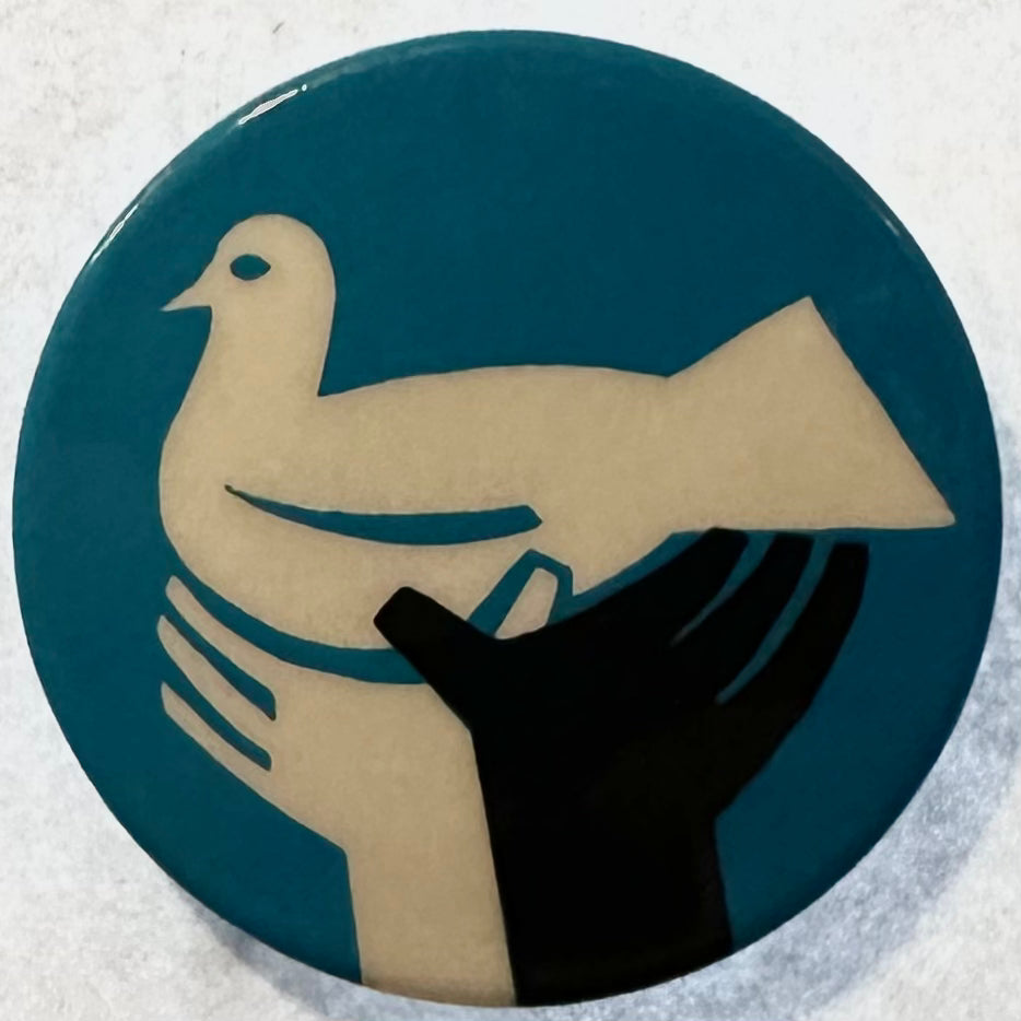 Peace Dove held up by Black and White Hands